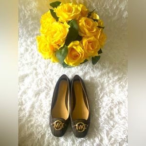 Black and brown flats from Michael Kors